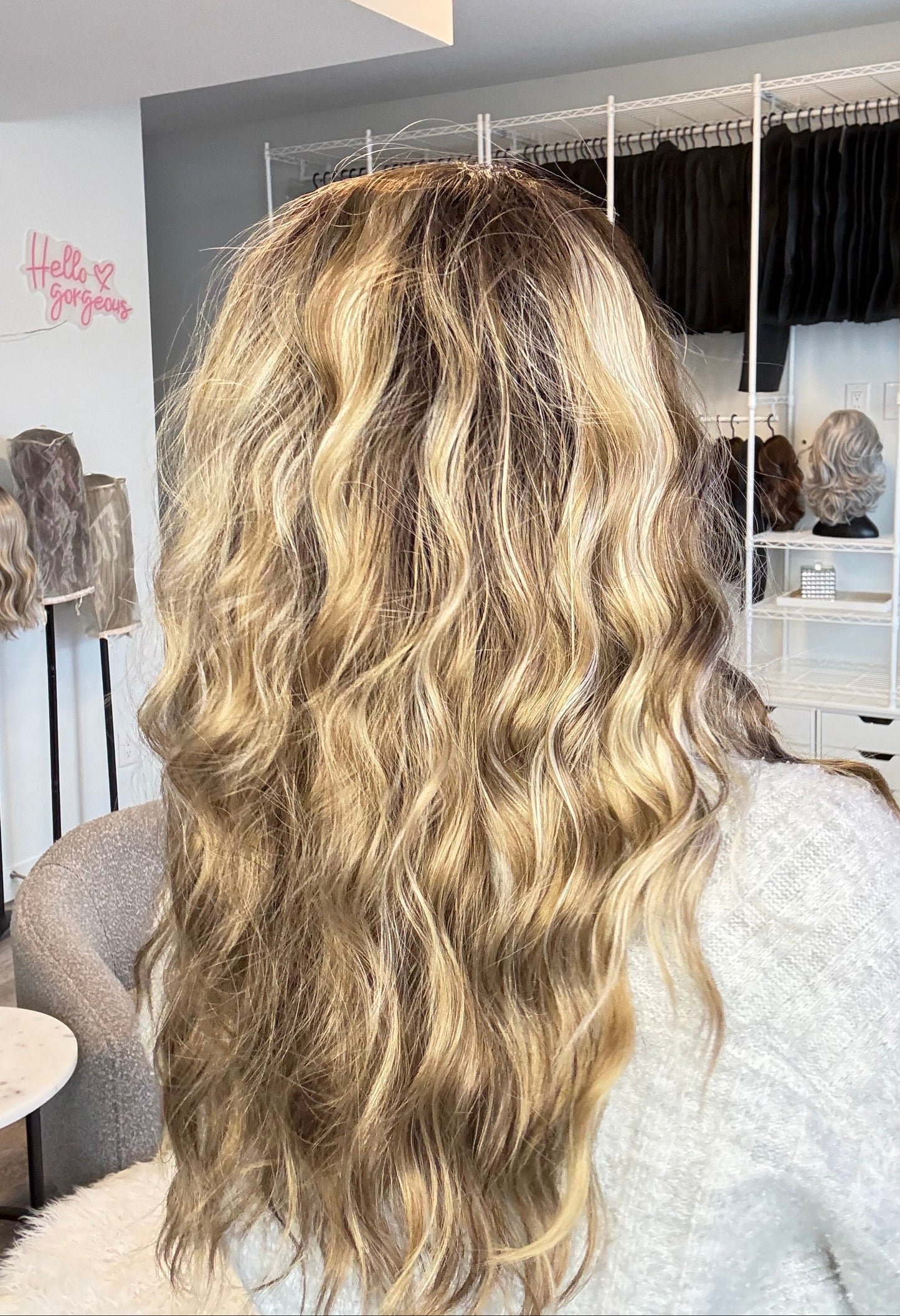 Close-up of wavy blonde hair with a blurred background