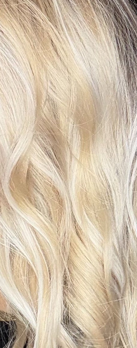 Woman with long blonde hair in a salon setting