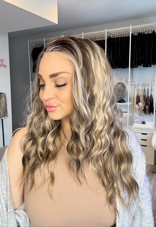 Woman with styled hair in a salon setting