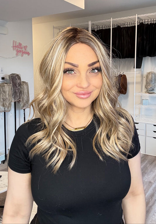 Woman with long blonde hair in a clothing store