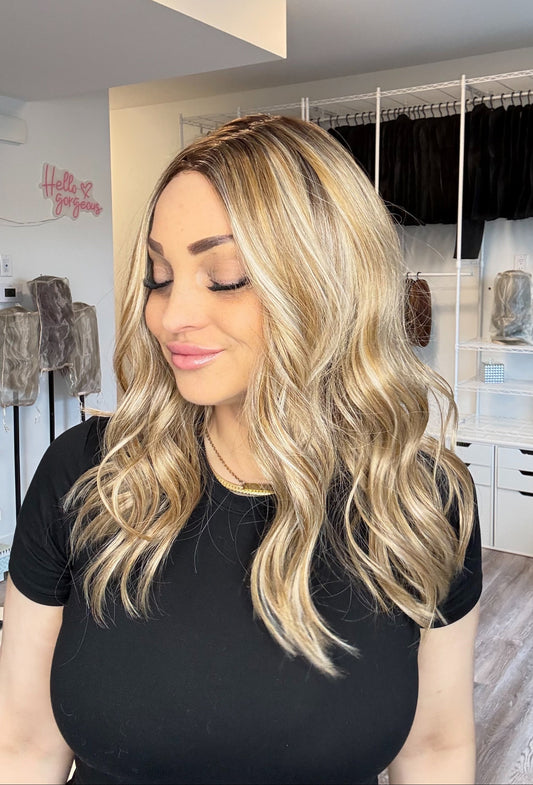 Woman with long blonde hair in a clothing store