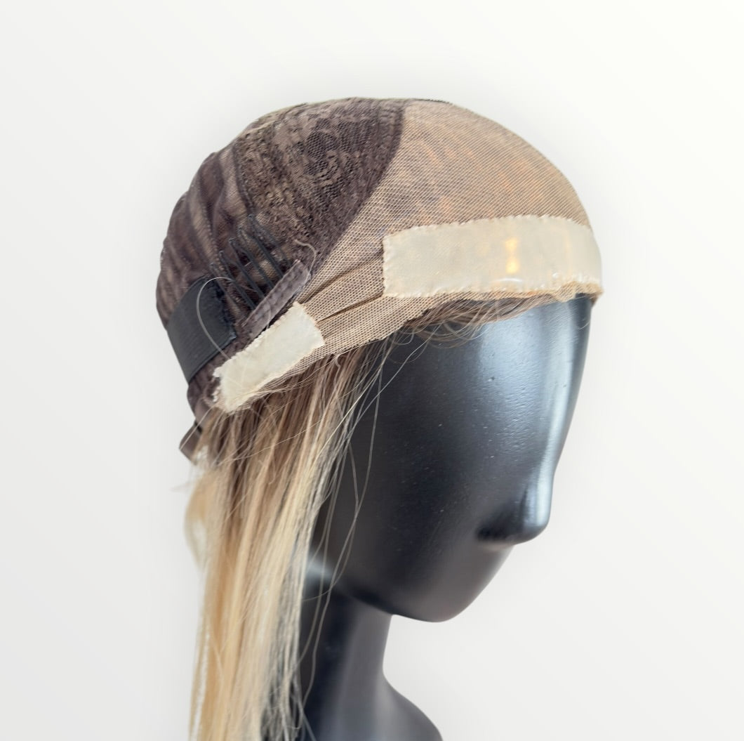 Wig cap on a mannequin head with a white background