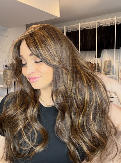 Woman with long, wavy hair in a store setting