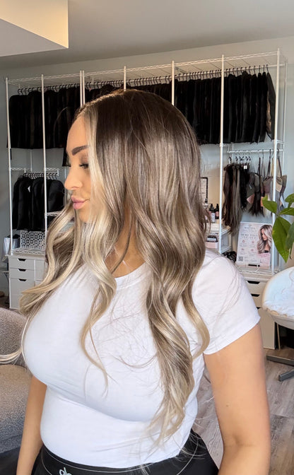 Mannequin wearing a 25‑inch brown‑to‑blonde ombré 13x4 lace front wig.