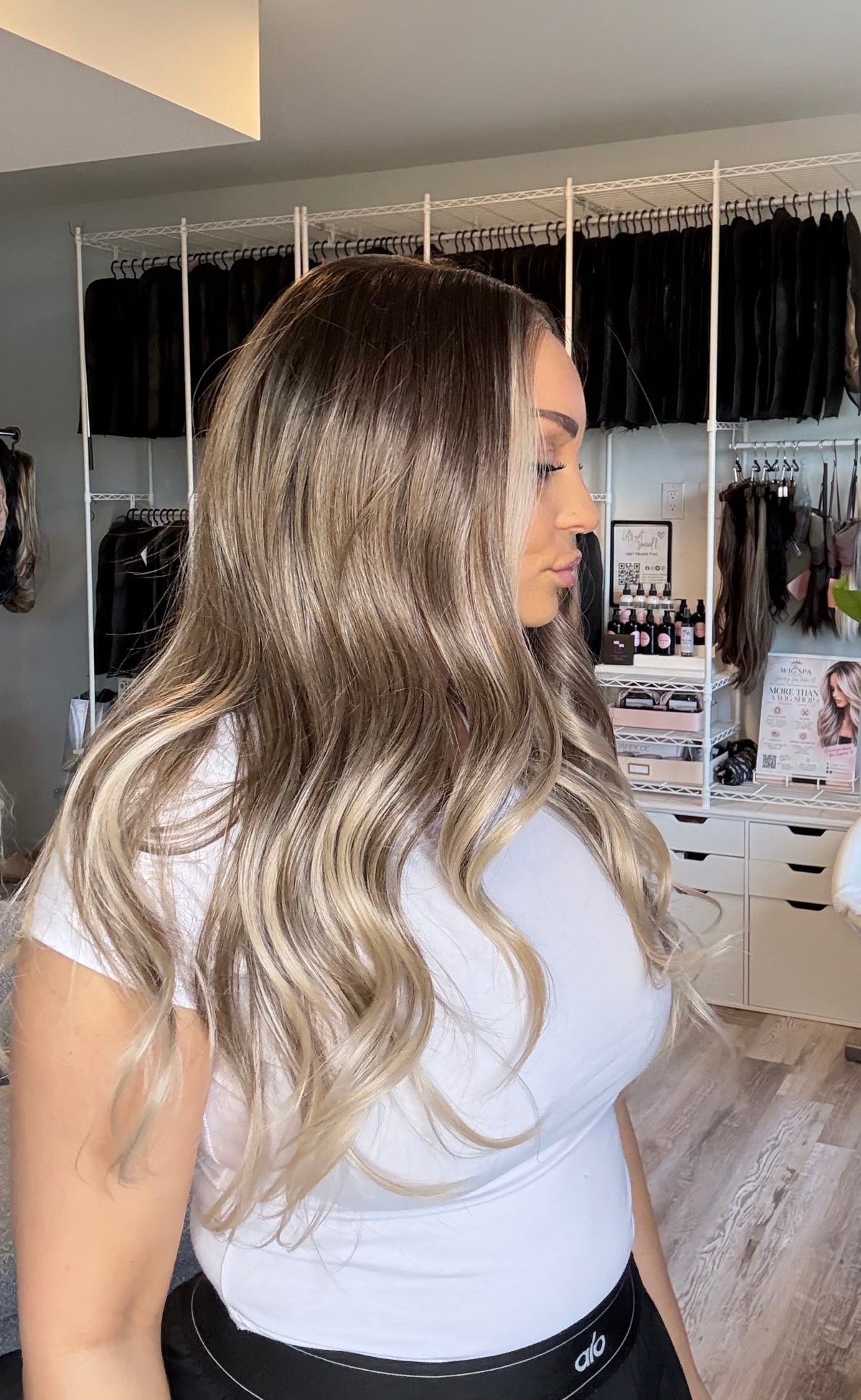 Mannequin wearing a 25‑inch brown‑to‑blonde ombré 13x4 lace front wig.
