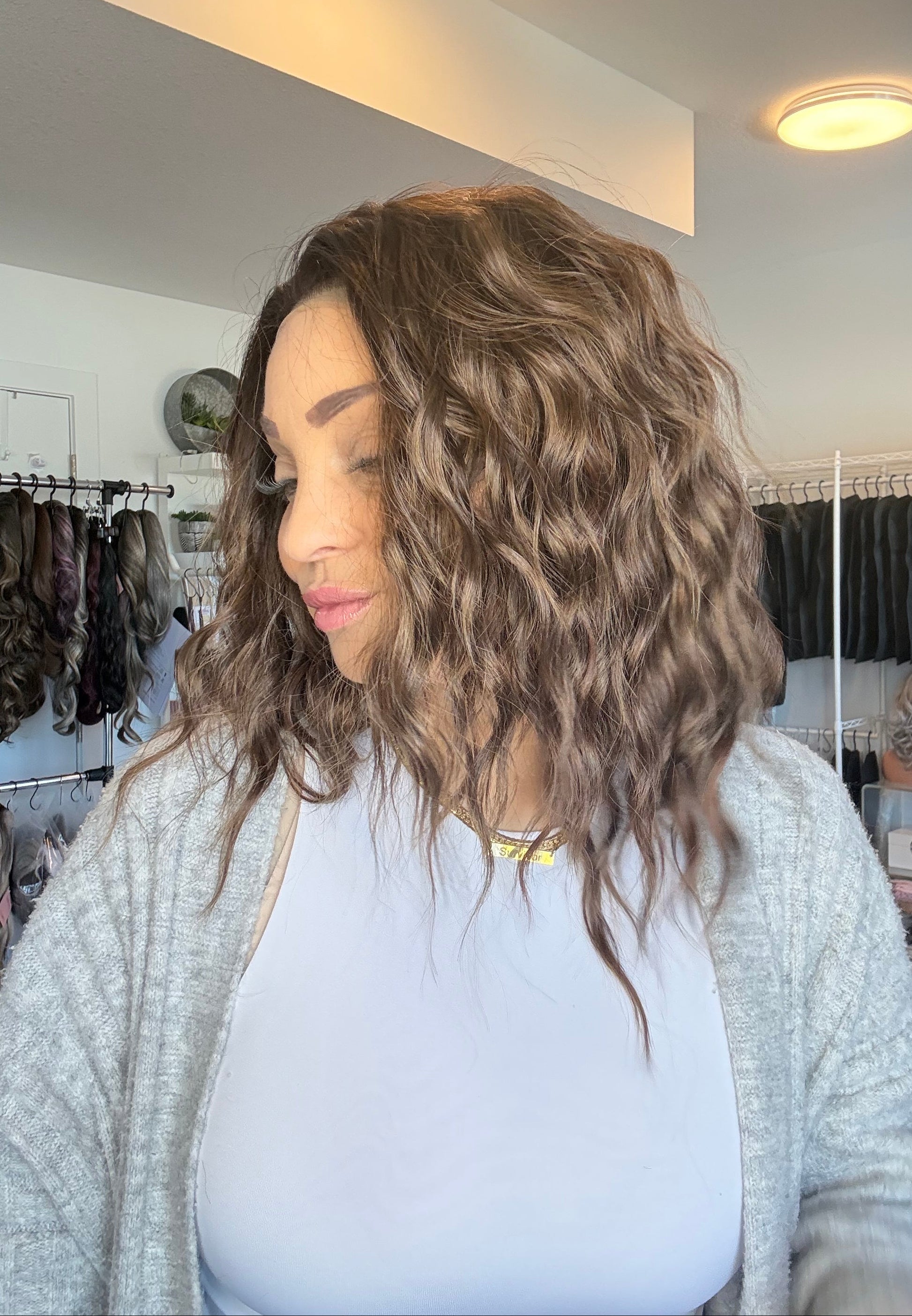 Person with wavy hair in a salon setting