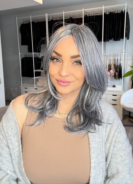 Woman with gray hair in a salon setting
