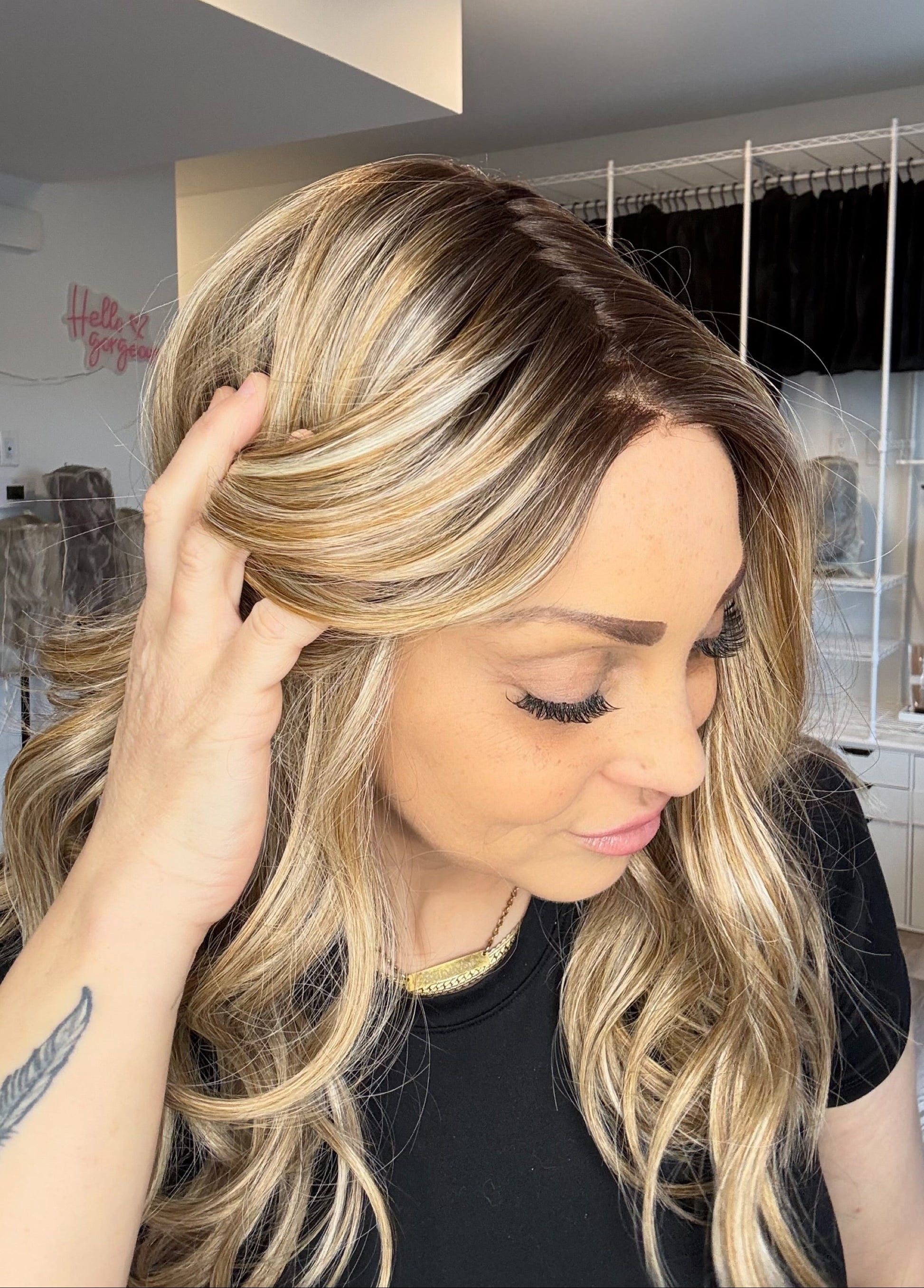 Woman with styled hair in a salon setting