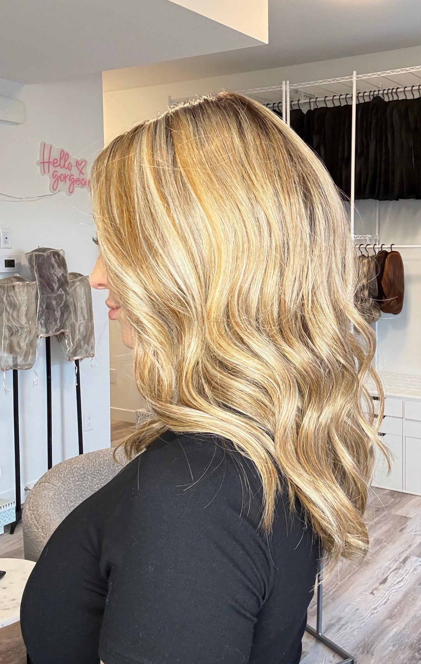 Person with blonde hair in a salon setting