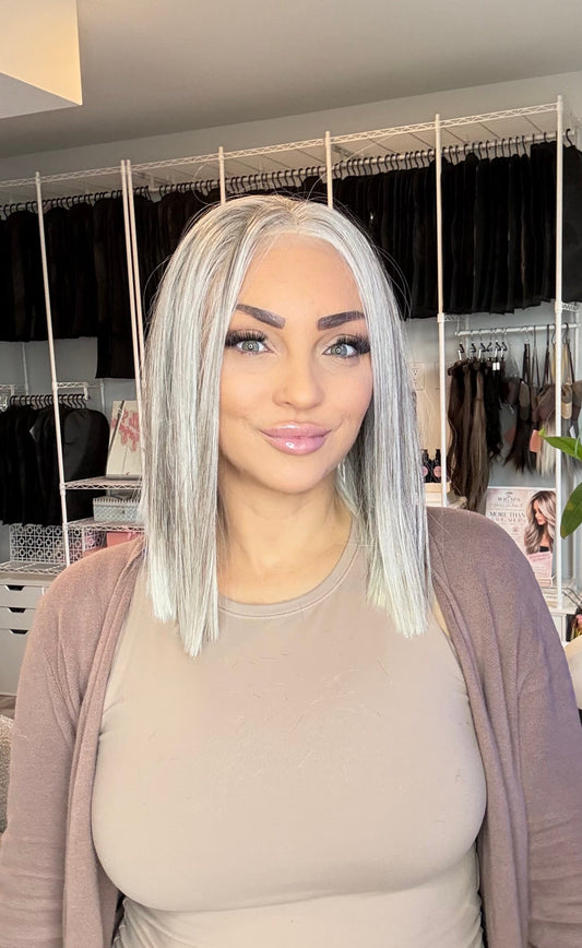 Short ash-blonde 13x6 transparent lace front bob styled on a mannequin head.