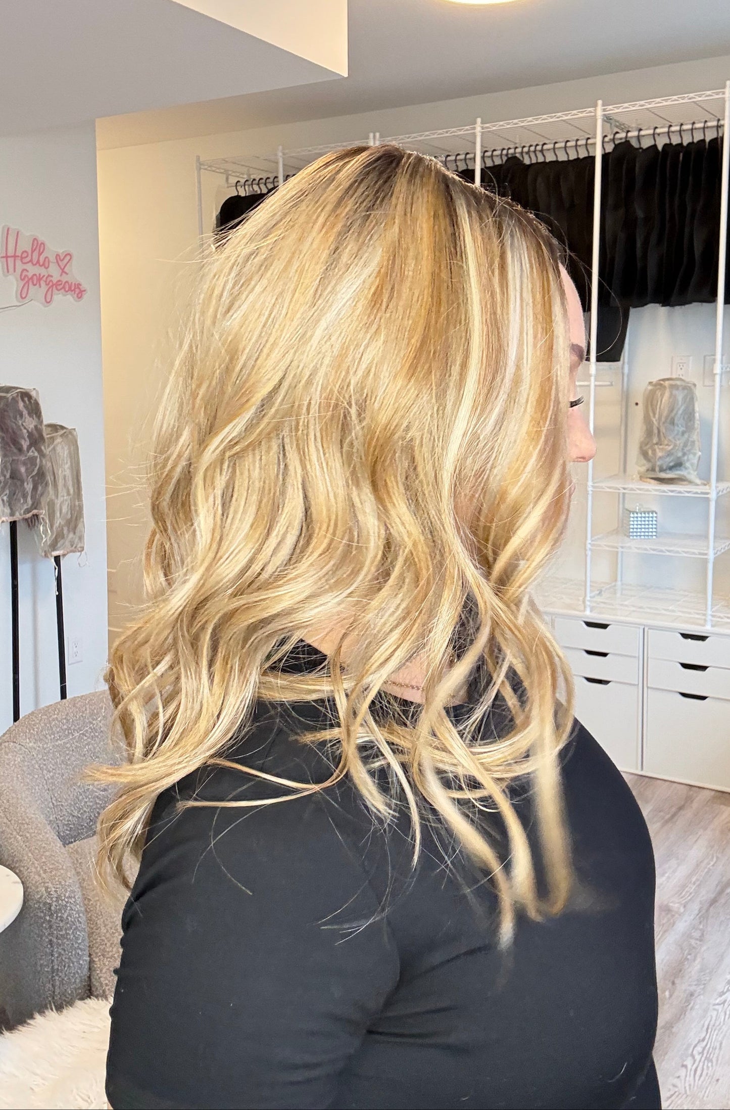 Person with blonde hair in a salon setting