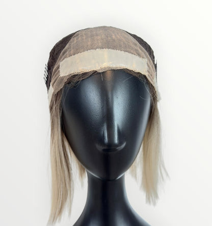 Mannequin head with a wig on a white background