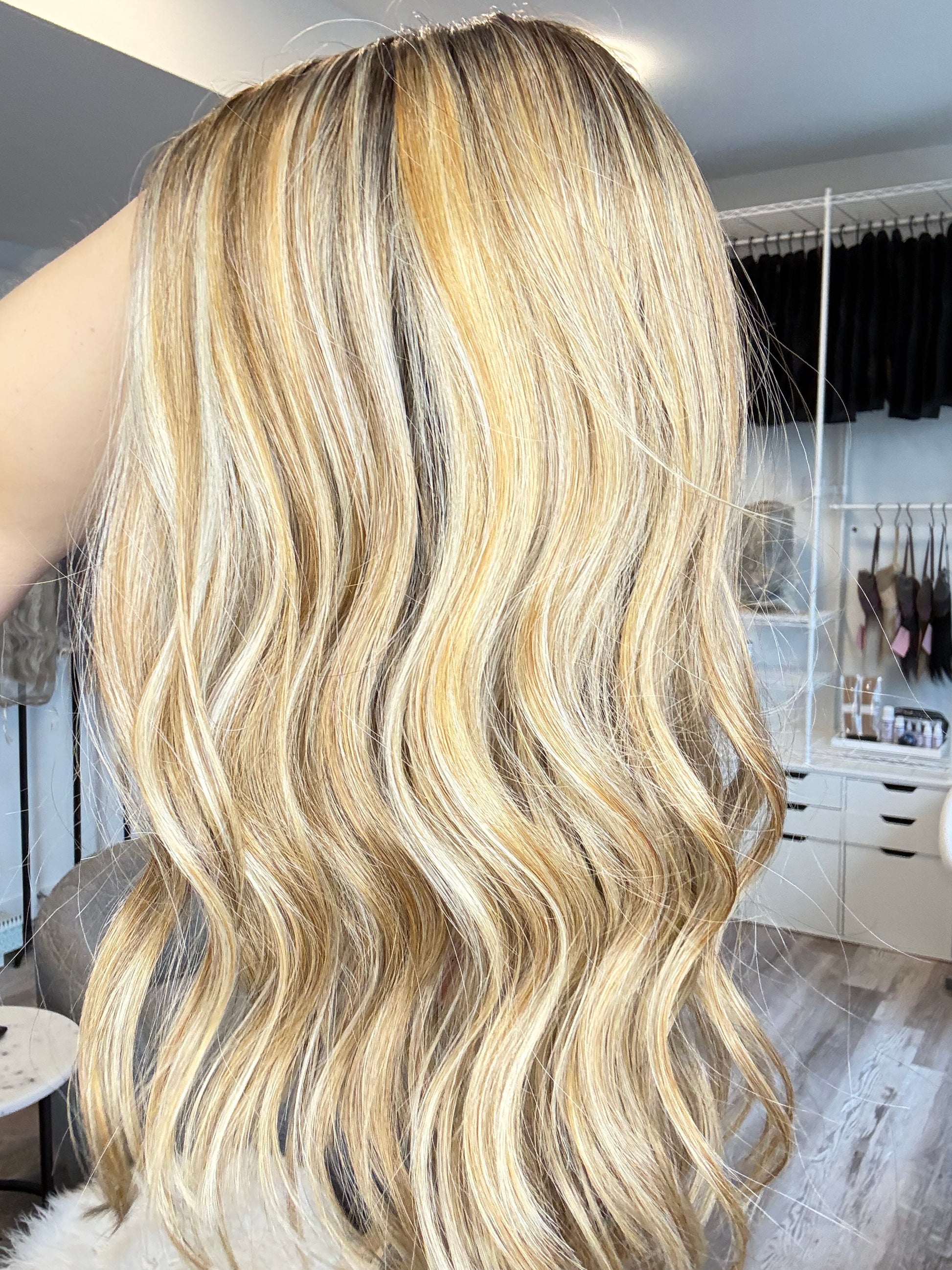 Blonde wig on a mannequin head with a blurred background