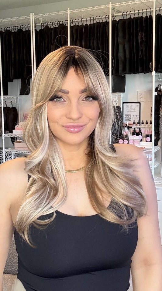 Sandi rooted beige blonde wig with wispy bangs and soft waves, Everyday Ready non-lace wig, The Wig Spa Canada