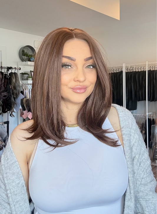 Woman with styled hair in a clothing store