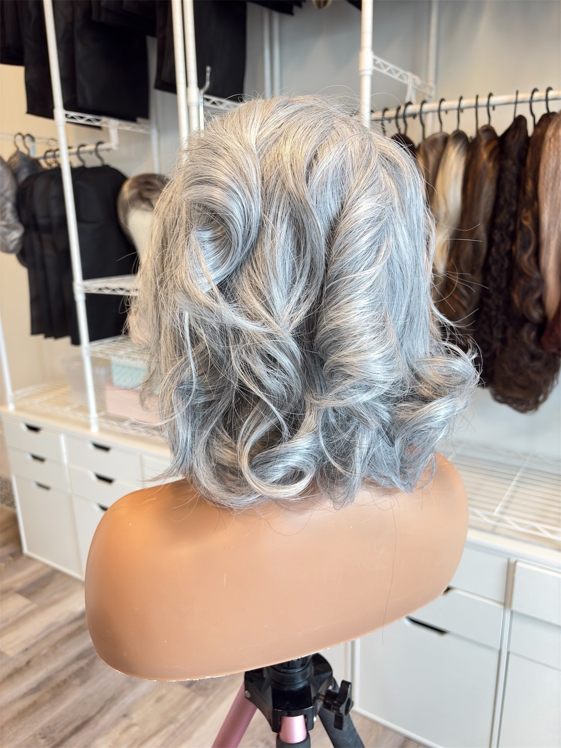 Mannequin head with silver hair in a salon setting