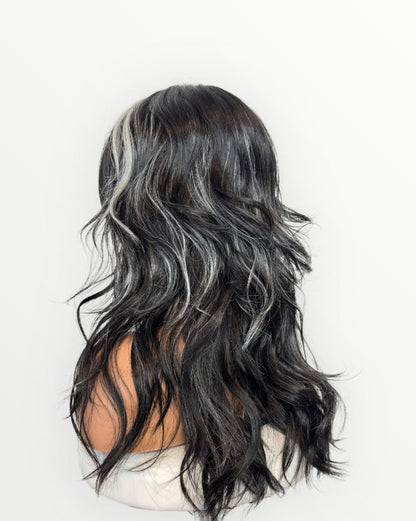 Black and gray ombre wig on a mannequin head against a white background