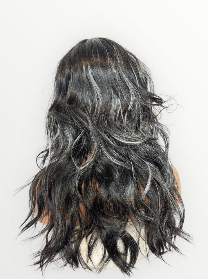 Long, wavy hairpiece with black and gray color on a white background