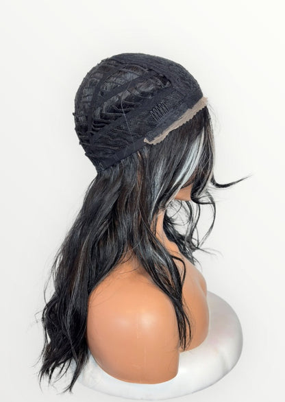 Mannequin head with a black lace front wig on a white background