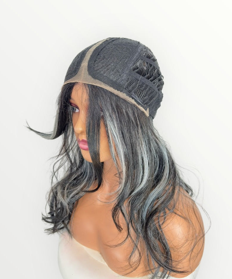 Mannequin head with gray wig and beige beanie on a white background