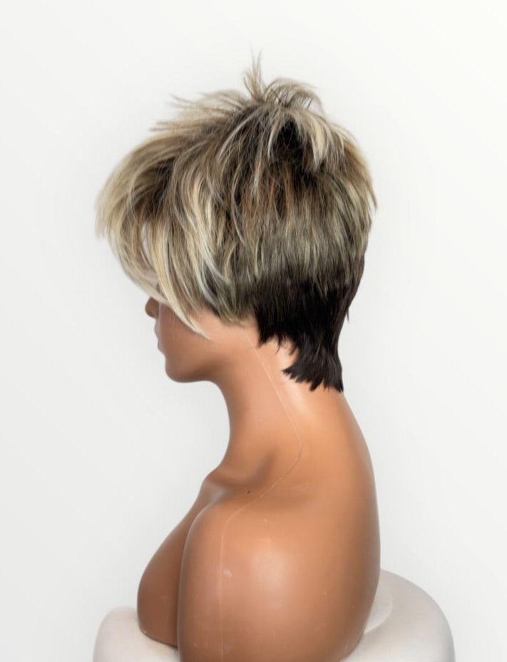 Person wearing a short, styled wig on a white background