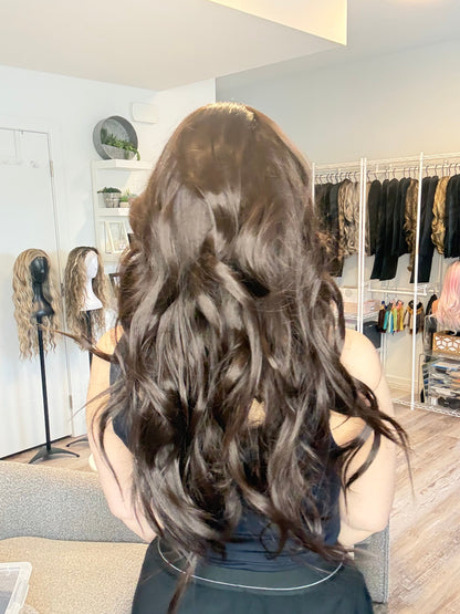 Person with styled hair in a salon setting