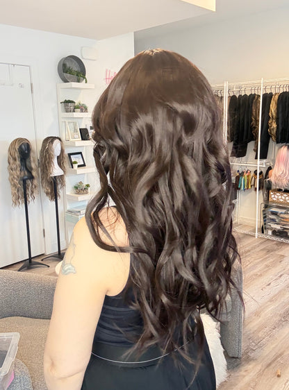 Person with styled hair in a salon setting