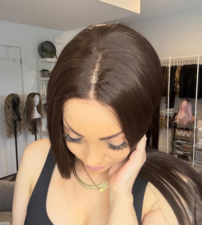 Woman with styled hair in a salon setting