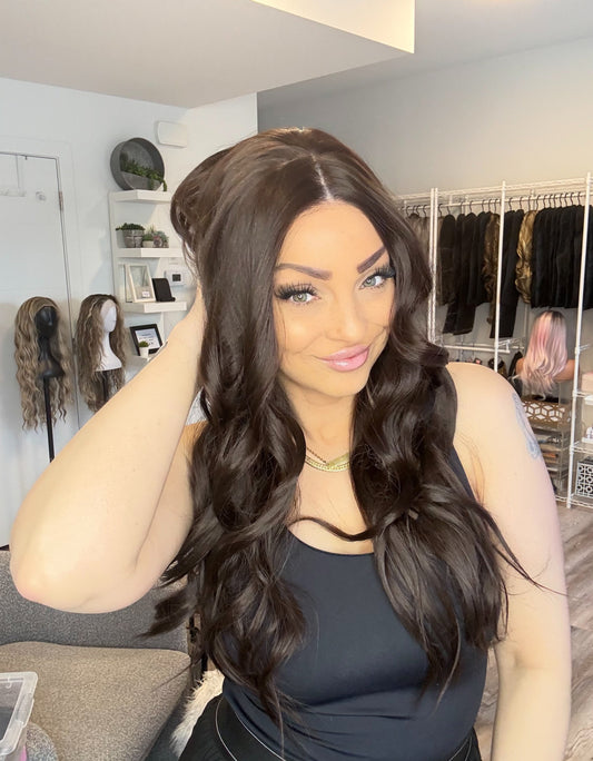 Woman with styled hair in a salon setting