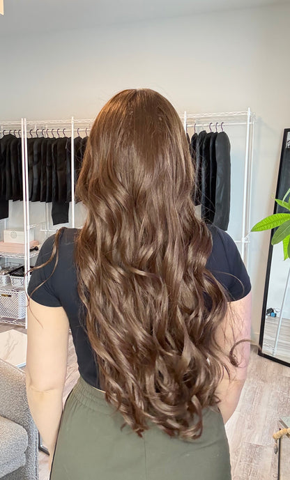 Person with styled hair in a salon setting