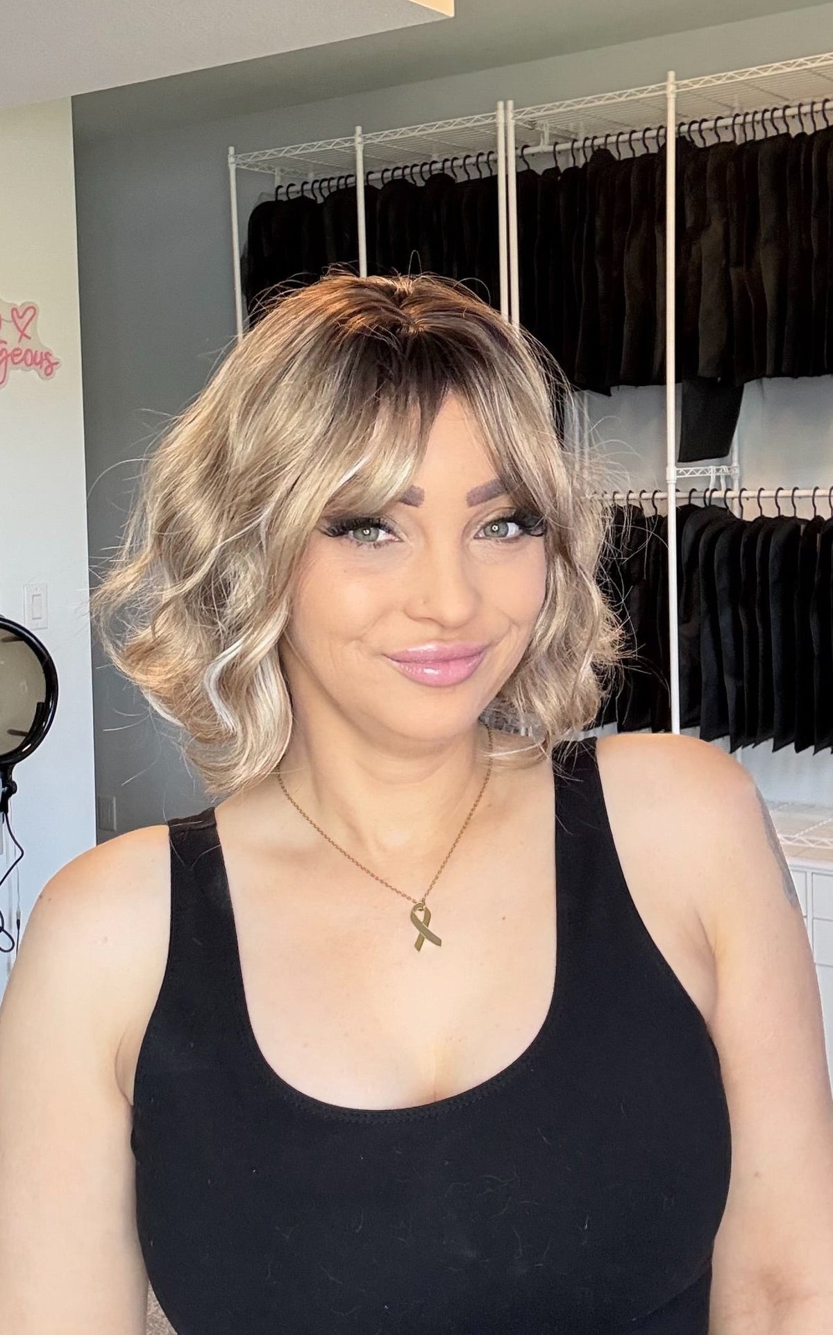 Sage warm brunette wavy bob with blonde highlights and full fringe, Everyday Ready non-lace wig, The Wig Spa Canada