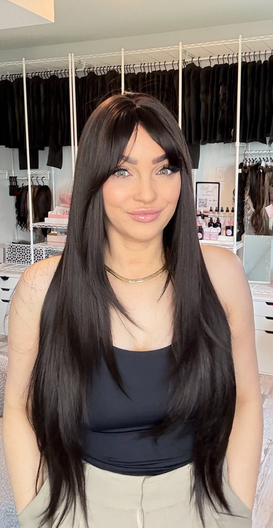Sally long black wig with full bangs and silky straight layers, Everyday Ready non-lace wig, The Wig Spa Canada